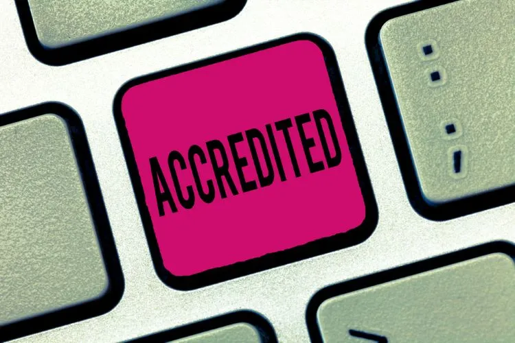 accredited button on laptop